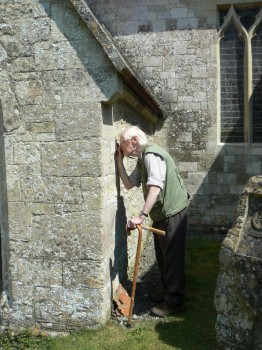 Assessing building stones at Chilmark Church, Wiltshire. Chilmark Stone is famous for its use in Salisbury Cathedral.